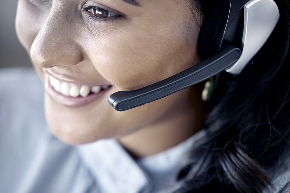 24/7 customer service representative speaking with client